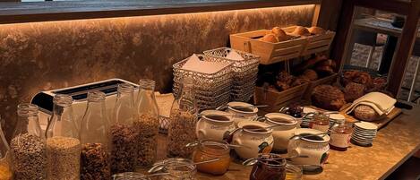 A kitchen counter with various food items and containers.