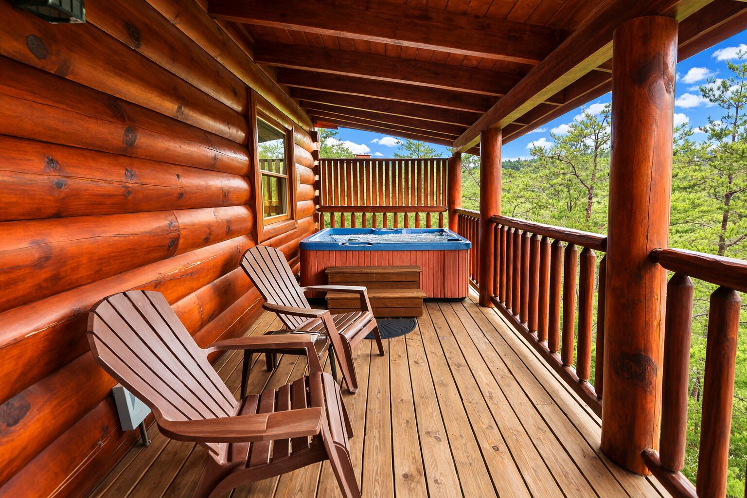 A wooden deck with Adirondack chairs and a hot tub.