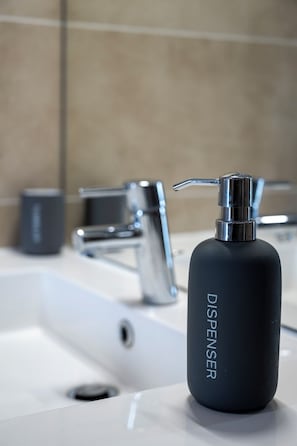 Shower, hair dryer, towels, soap