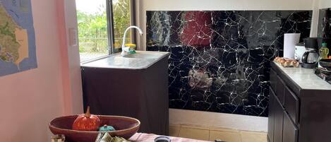 Fridge, coffee/tea maker, toaster, cookware/dishes/utensils