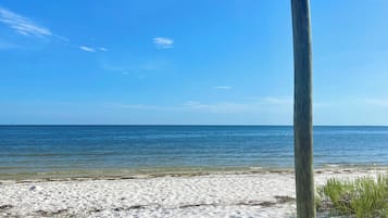 On the beach, sun loungers, beach towels