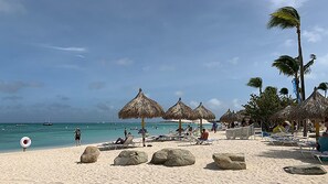 On the beach, sun-loungers, beach towels