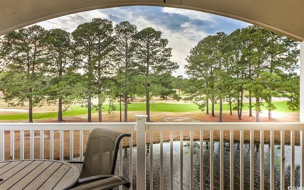 Outdoor dining - Spacious 3-bedroom Condo with view of stream and golf course. (Myrtle Beach)
