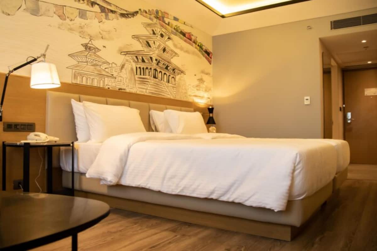 Chambre Deluxe, 2 lits une place | Minibar, coffres-forts dans les chambres, rideaux occultants