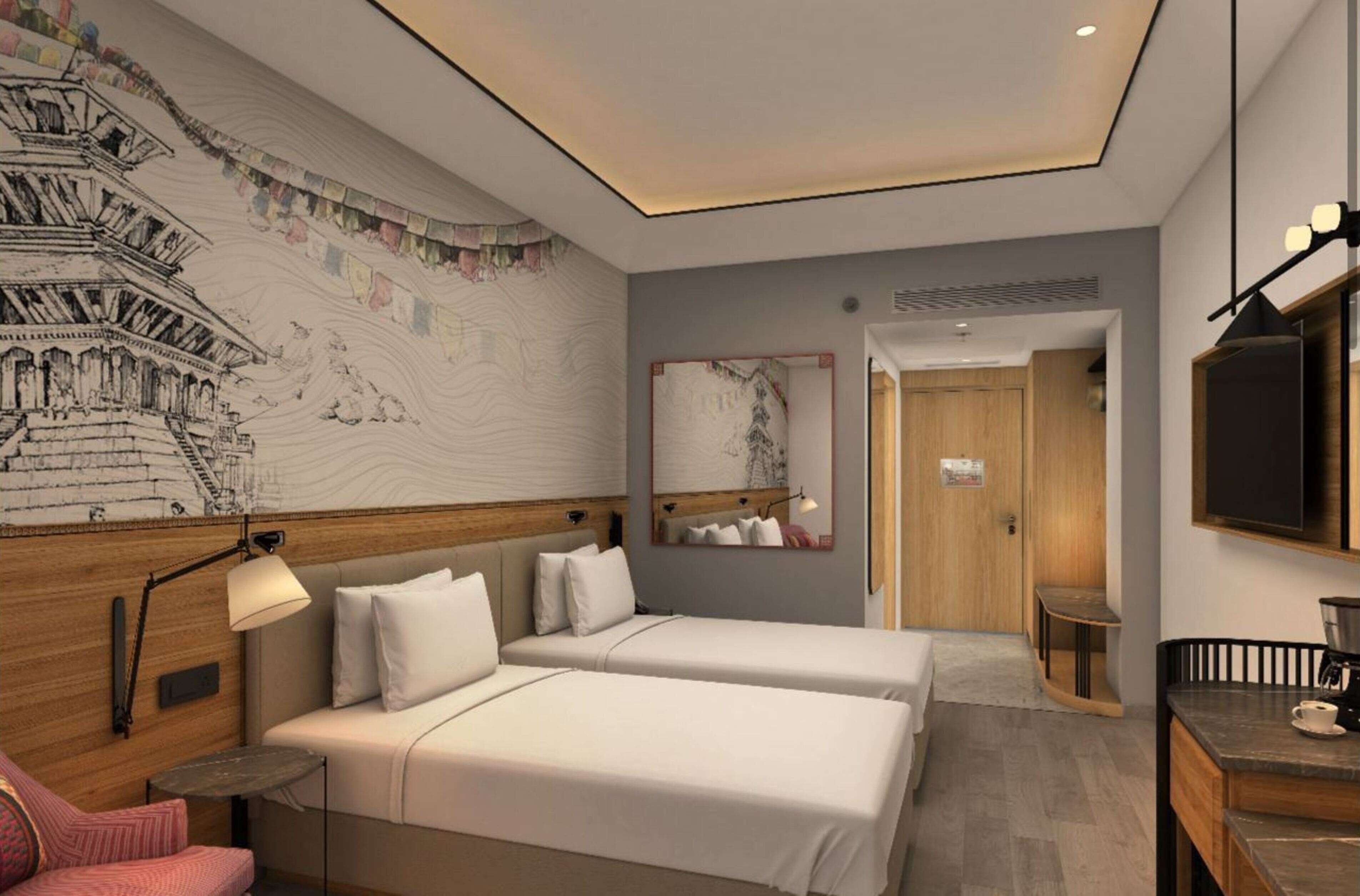 A hotel room with two beds, a desk, a chair, a lamp, a mirror, and a wall with a mural.