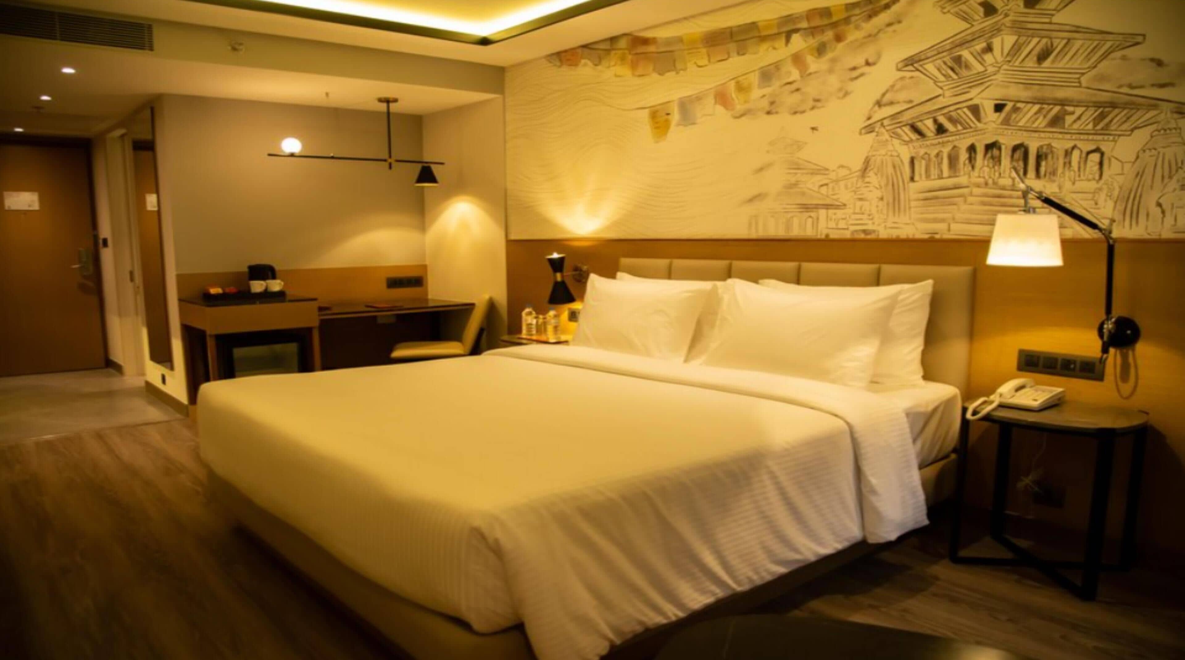 Suite, 1 lit double, vue ville | Minibar, coffres-forts dans les chambres, rideaux occultants