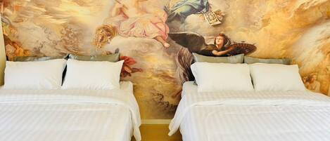A hotel room with two beds, a mural of mythological figures on the wall, and a wooden floor.