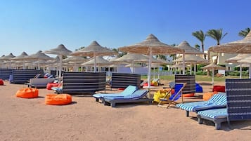 On the beach, sun loungers, beach towels, beach massages