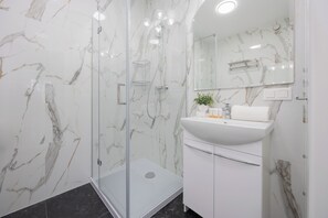 Apartment, 1 Bedroom, Balcony | Bathroom | Shower, free toiletries, towels, soap