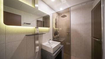 King Room | Bathroom | Shower, hair dryer, slippers, soap