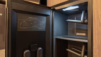 A modern, compact refrigerator with a digital display and a sleek design.