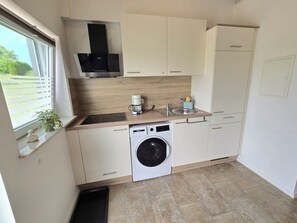 Fridge, microwave, stovetop, coffee/tea maker