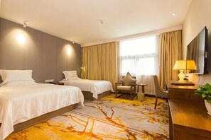 A hotel room with two beds, a desk, a chair, a TV, and a window with curtains. - Dongfang Yuehai Hotel (Zhengzhou)