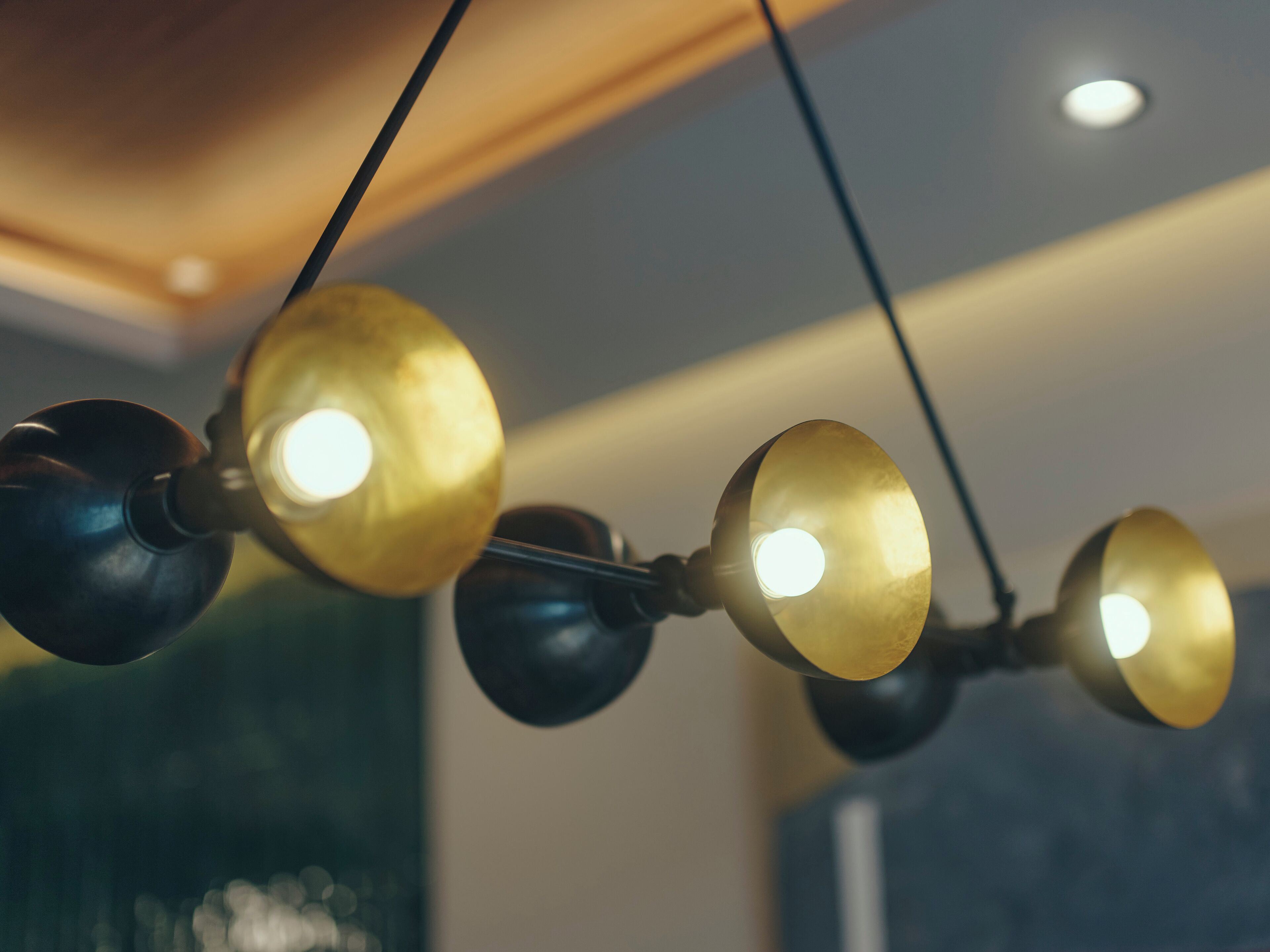 A ceiling with a series of pendant lights.