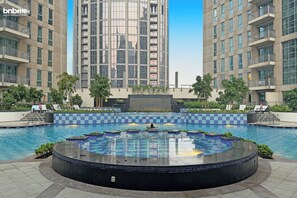 Outdoor pool - bnbme | Stand Point Tower A | 1BR + Study Room (Dubai)