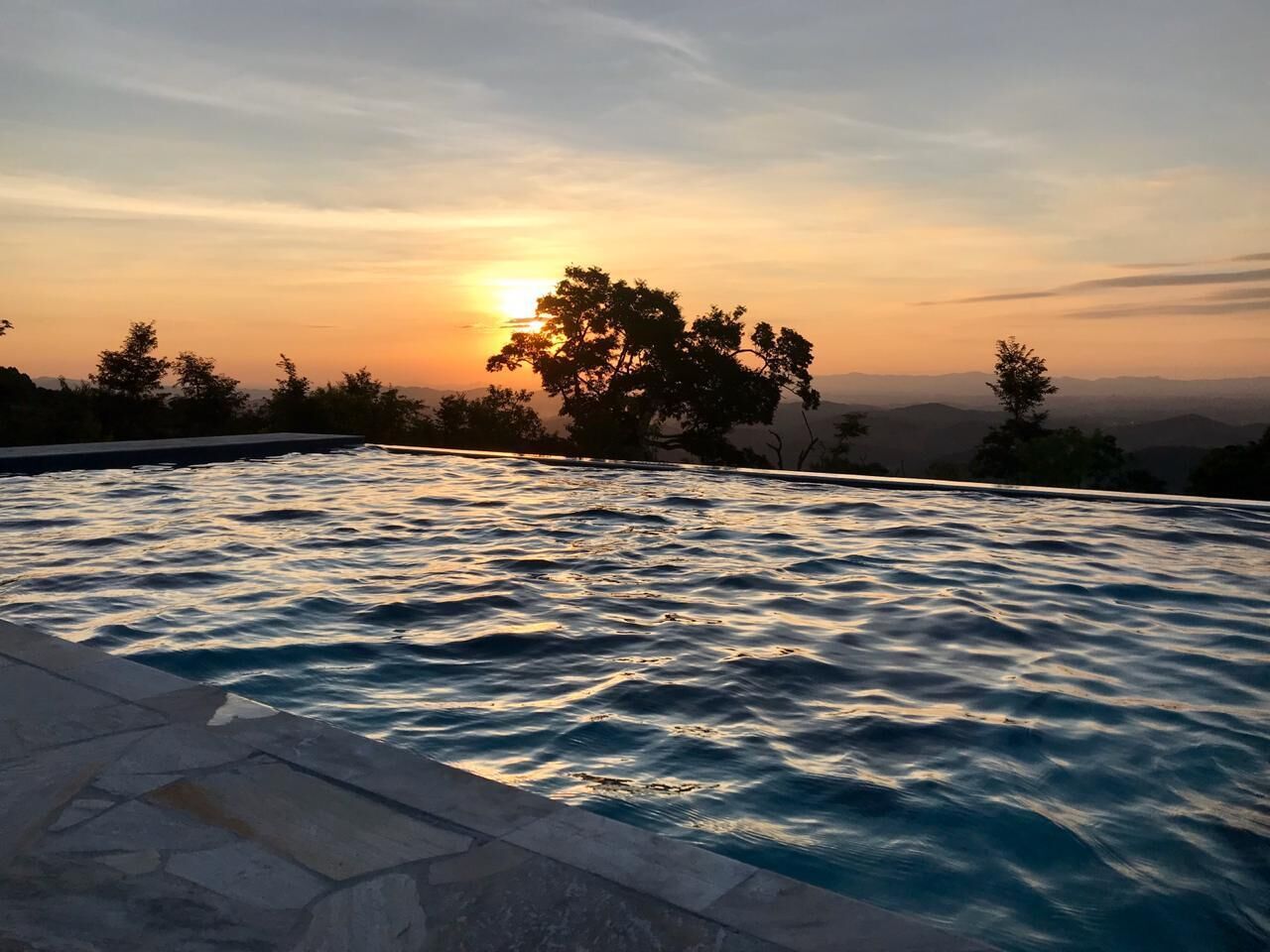 Outdoor pool, open 10:00 AM to 5:00 PM, pool umbrellas