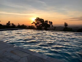 Outdoor pool, open 10:00 AM to 5:00 PM, pool umbrellas