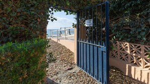 A gated entrance with a sign indicating private property. - El Morche in El Morche (Torrox)