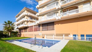 A multi-story hotel with a swimming pool, balconies, and a well-maintained lawn. - El Morche in El Morche (Torrox)