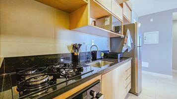 Signature Apartment | Private kitchen | Fridge, microwave, coffee/tea maker, blender
