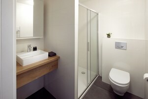 Luxury Studio | Bathroom | Shower, towels, soap, toilet paper