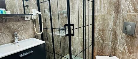 Shower, hair dryer, slippers, towels