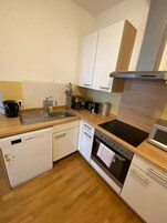 Apartment | Private kitchen | Fridge, oven, stovetop, dishwasher