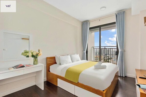 Relax in a stylish room with a large bed, city views, and a balcony.