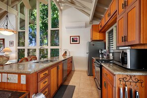 Fridge, stovetop, dishwasher, coffee/tea maker