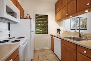 Fridge, stovetop, dishwasher, coffee/tea maker