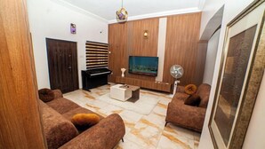 Deluxe Room, Balcony, City View | Living area | TV - Schemes Apartment Portharcourt (Port Harcourt)