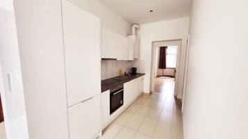 Apartamento, 2 habitaciones | Cocina privada | Frigorífico, horno, placa de cocina y máquina de café espresso