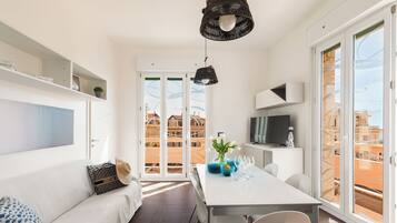 Deluxe Apartment, 3 Bedrooms, Balcony, Sea View | Living area | Flat-screen TV, DVD player