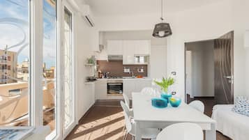 Deluxe Apartment, 3 Bedrooms, Balcony, Sea View | Living area | Flat-screen TV, DVD player