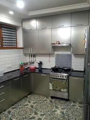 Fridge, microwave, electric kettle, cookware/dishes/utensils