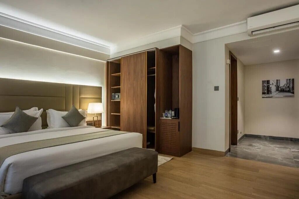 Deluxe Room with Balcony | Premium bedding, down comforters, in-room safe, blackout drapes