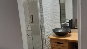 Shower, towels, soap, toilet paper