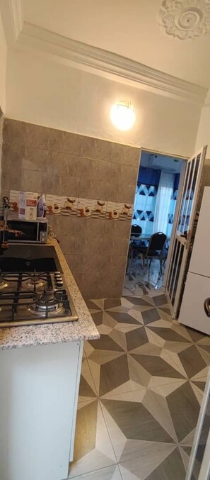 Fridge, microwave, stovetop, coffee/tea maker
