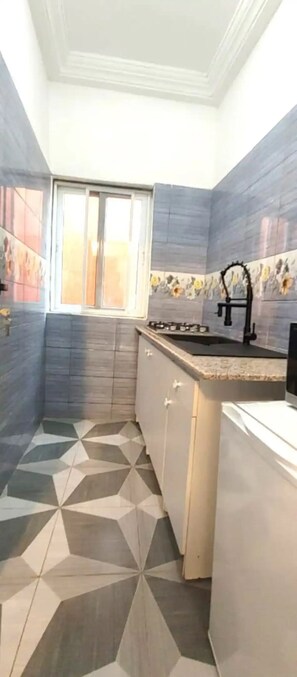 Fridge, microwave, stovetop, coffee/tea maker