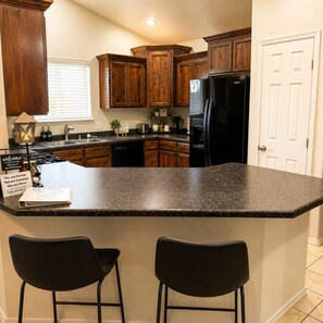 Coffee/tea maker, fridge, microwave, oven