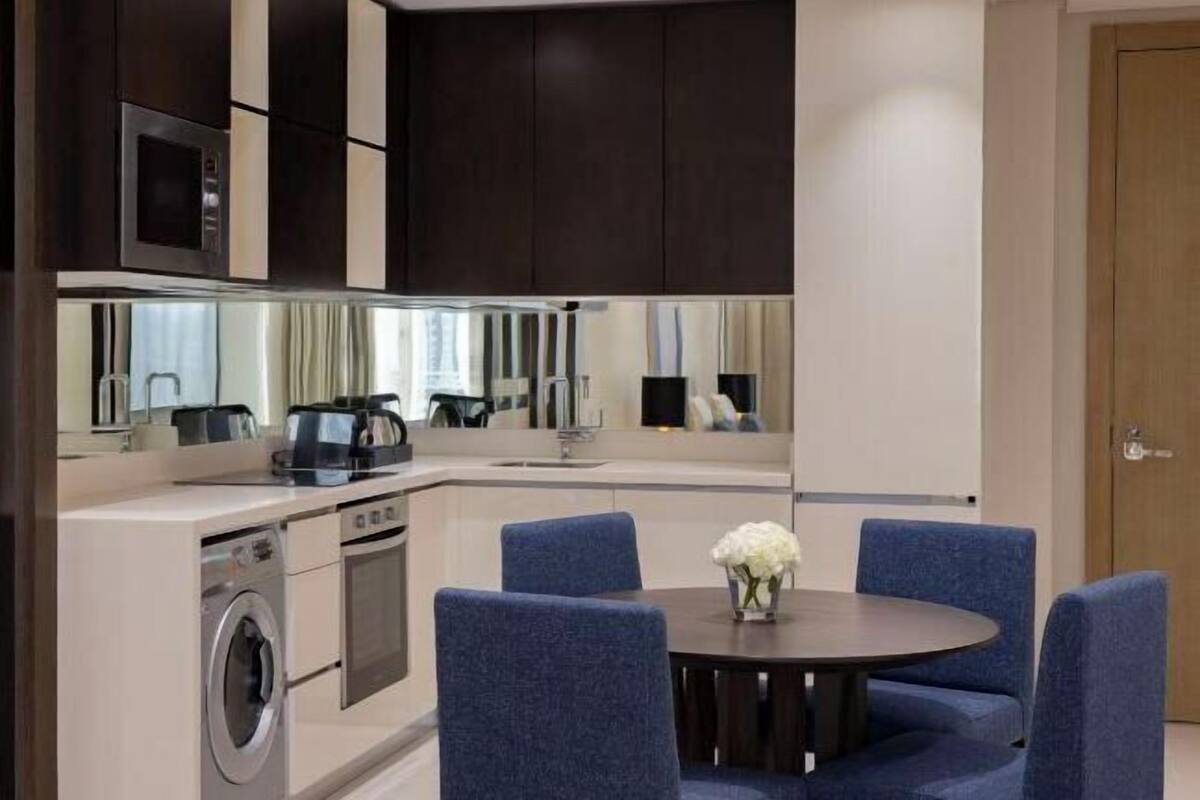 Espresso maker, coffee/tea maker, electric kettle, dining tables