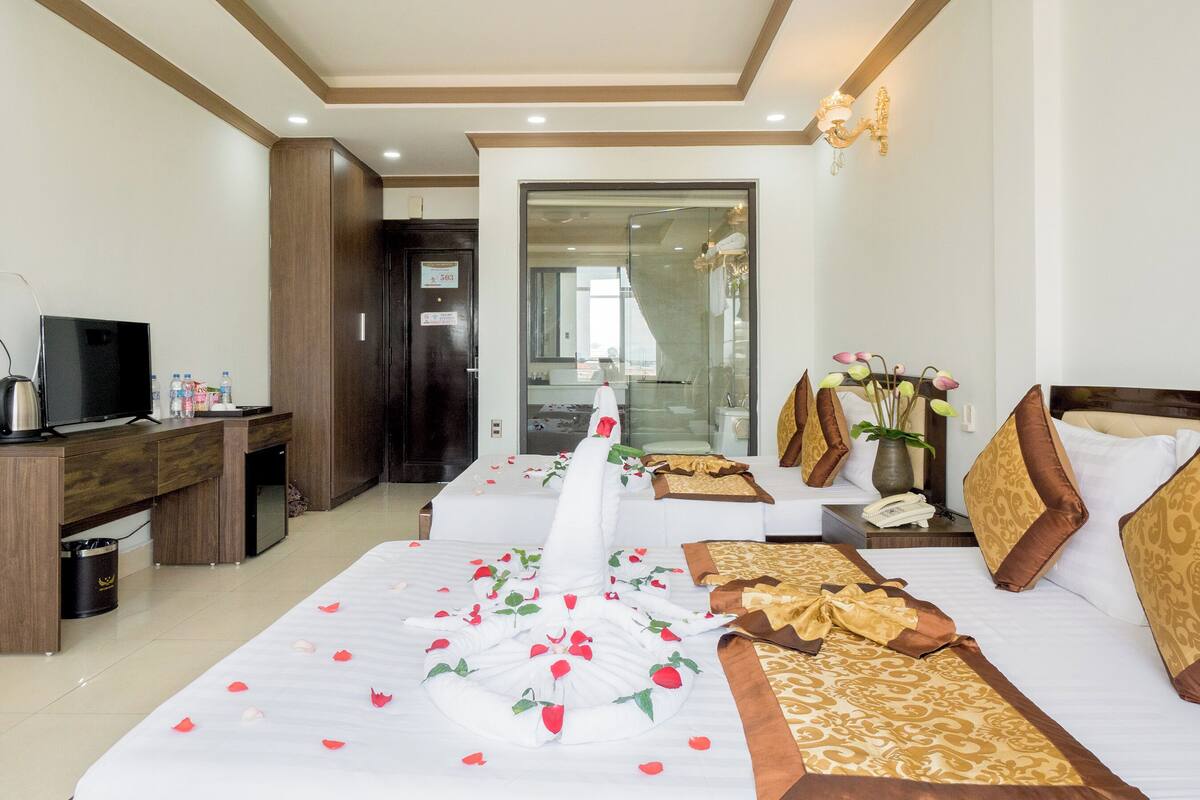 Deluxe Quadruple Room, Balcony, City View | Desk, laptop workspace, free WiFi