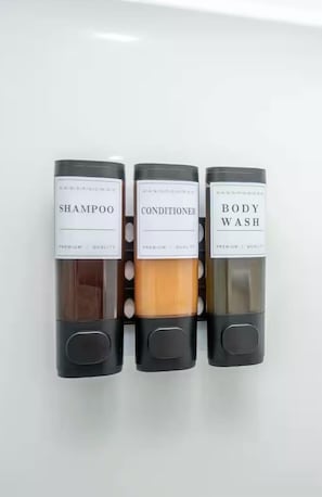 Shower, hair dryer, towels, shampoo