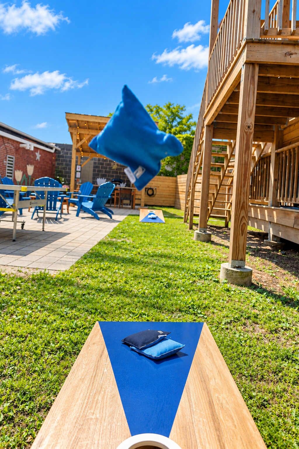Sunny Backyard Cornhole Game (1)