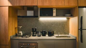 Apartment, Balcony, City View | Private kitchen | Microwave, oven, stovetop, coffee/tea maker