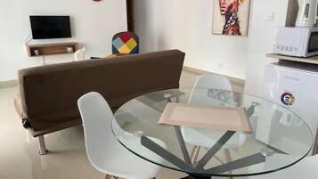 One Bedroom Apartment Suite 310 | Living area | Flat-screen TV