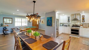 A spacious kitchen with white cabinets, a built-in oven, and a microwave. - Lakeside Retreat on 10 Secluded Wooded Acres, Hot Tub, Level 2 EV Charger (Greers Ferry)