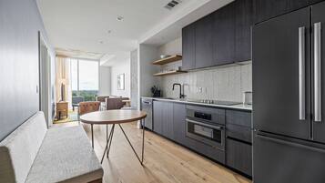 Condo, 1 King Bed with Sofa bed, City View | Private kitchen | Full-sized fridge, microwave, oven, stovetop