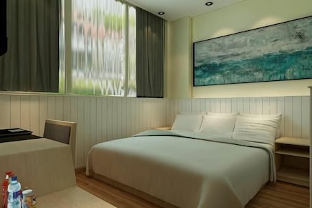 A modern hotel room with a large bed, a desk, and a window with curtains.. Fanke Hotel (Jinan Railway Station South Square Branch )
