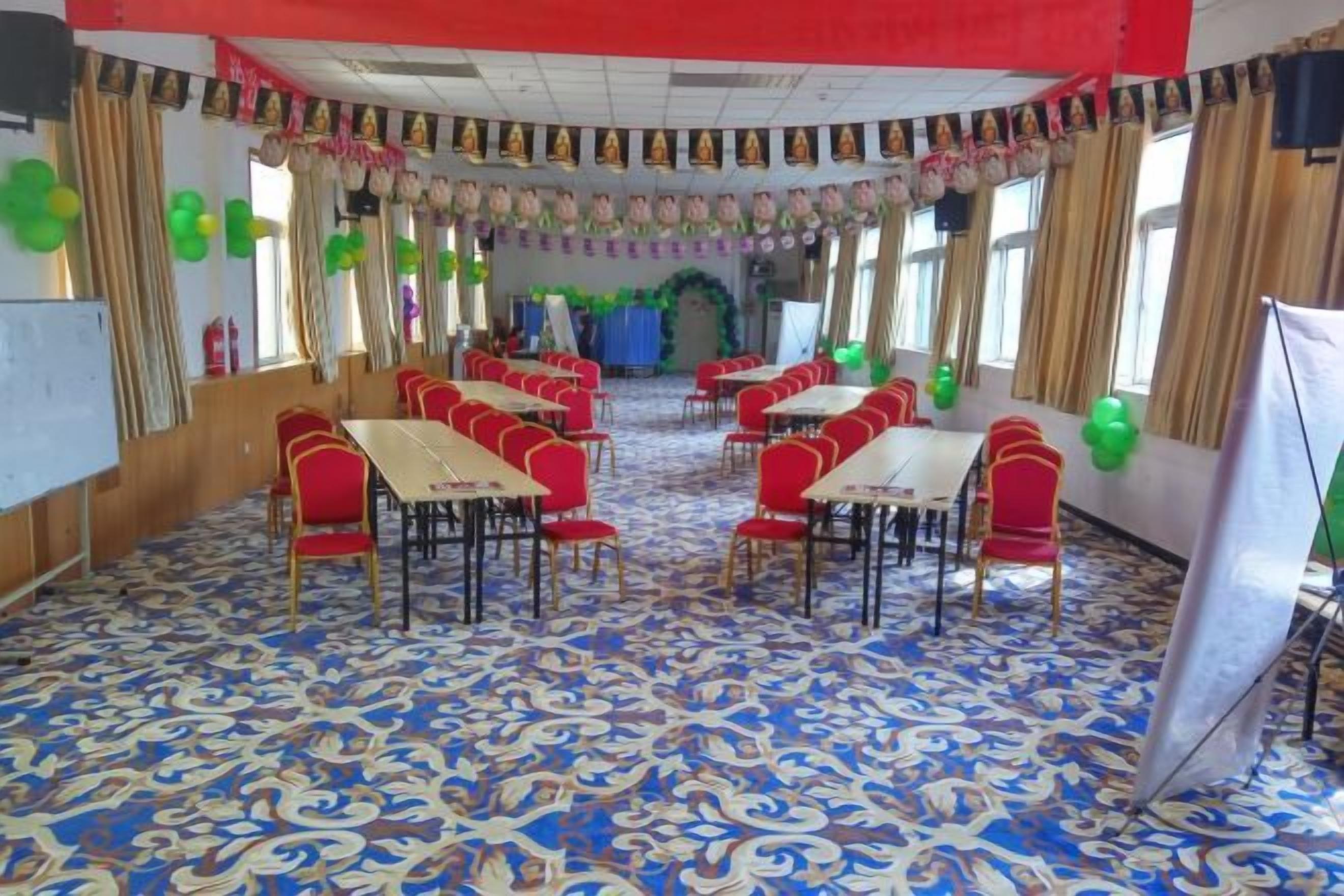 A banquet hall with tables and chairs arranged for events.